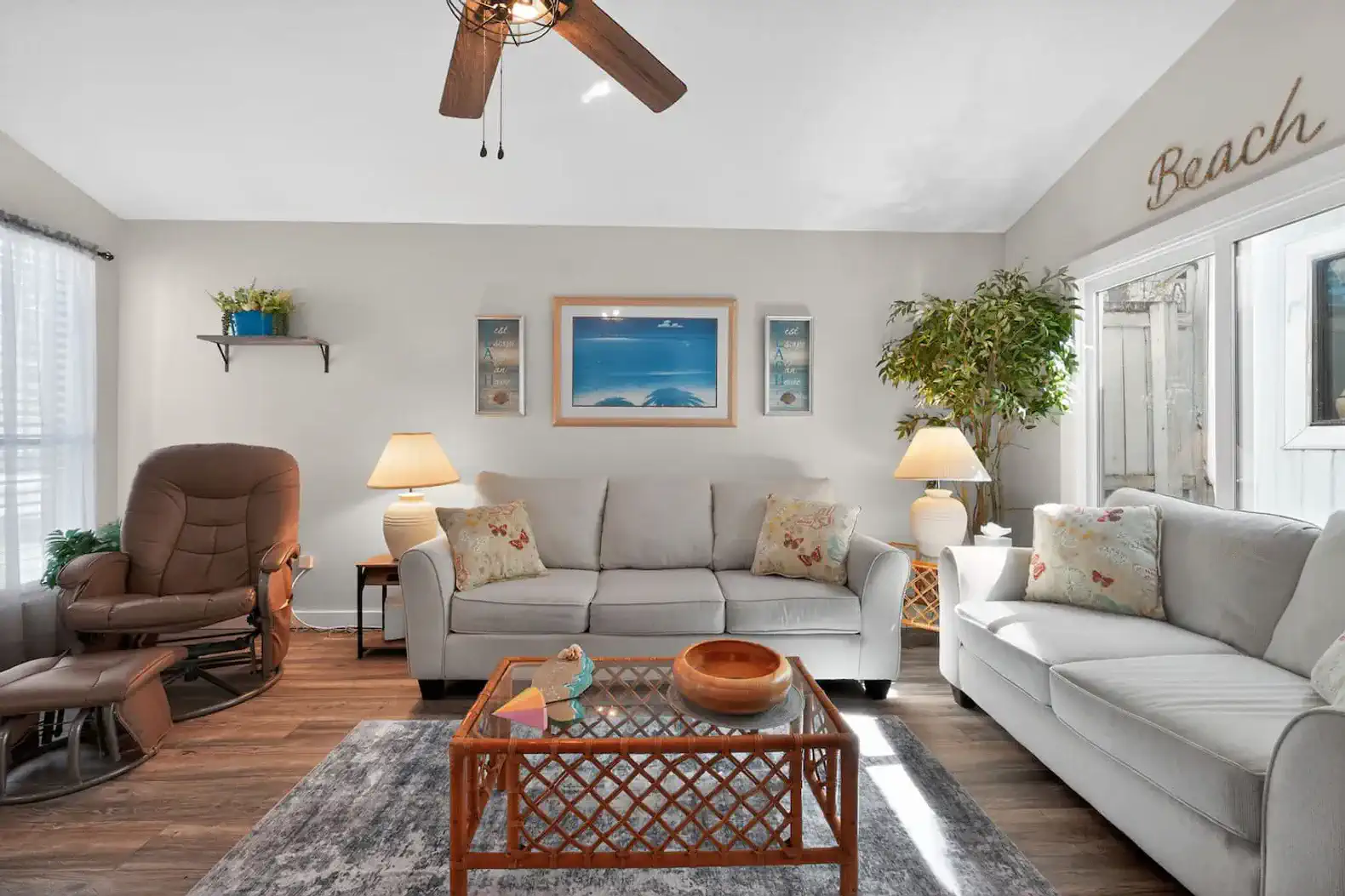 Cozy living room with comfortable seating and beach-themed decor