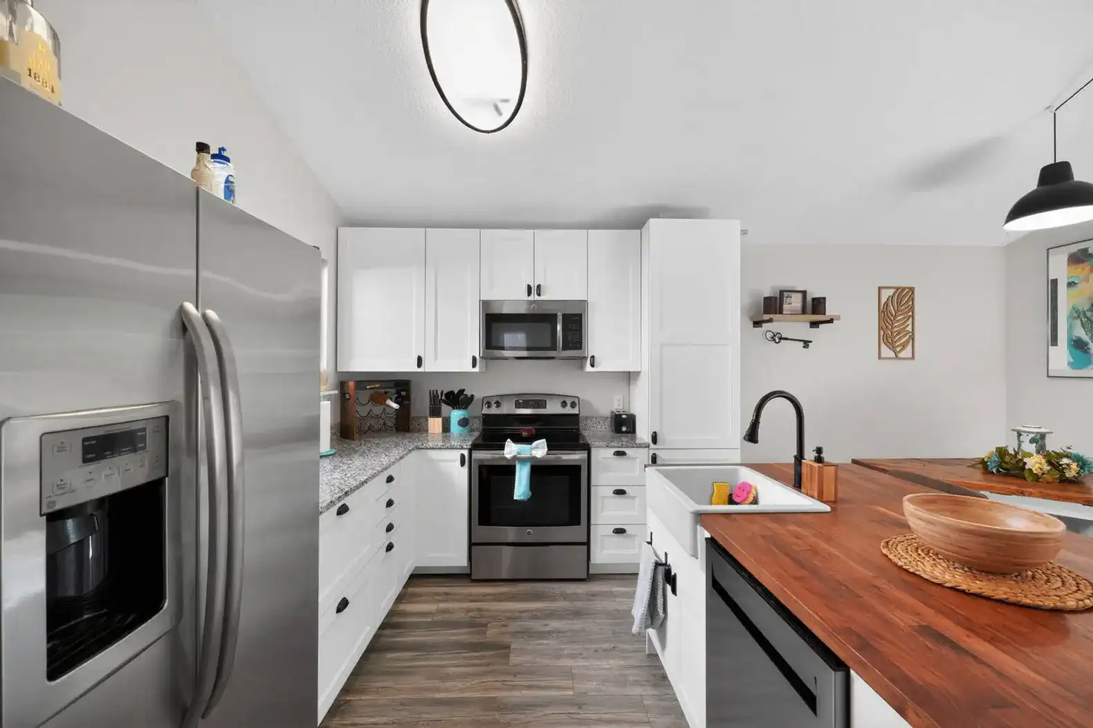 Modern kitchen with stainless steel appliances and granite countertops
