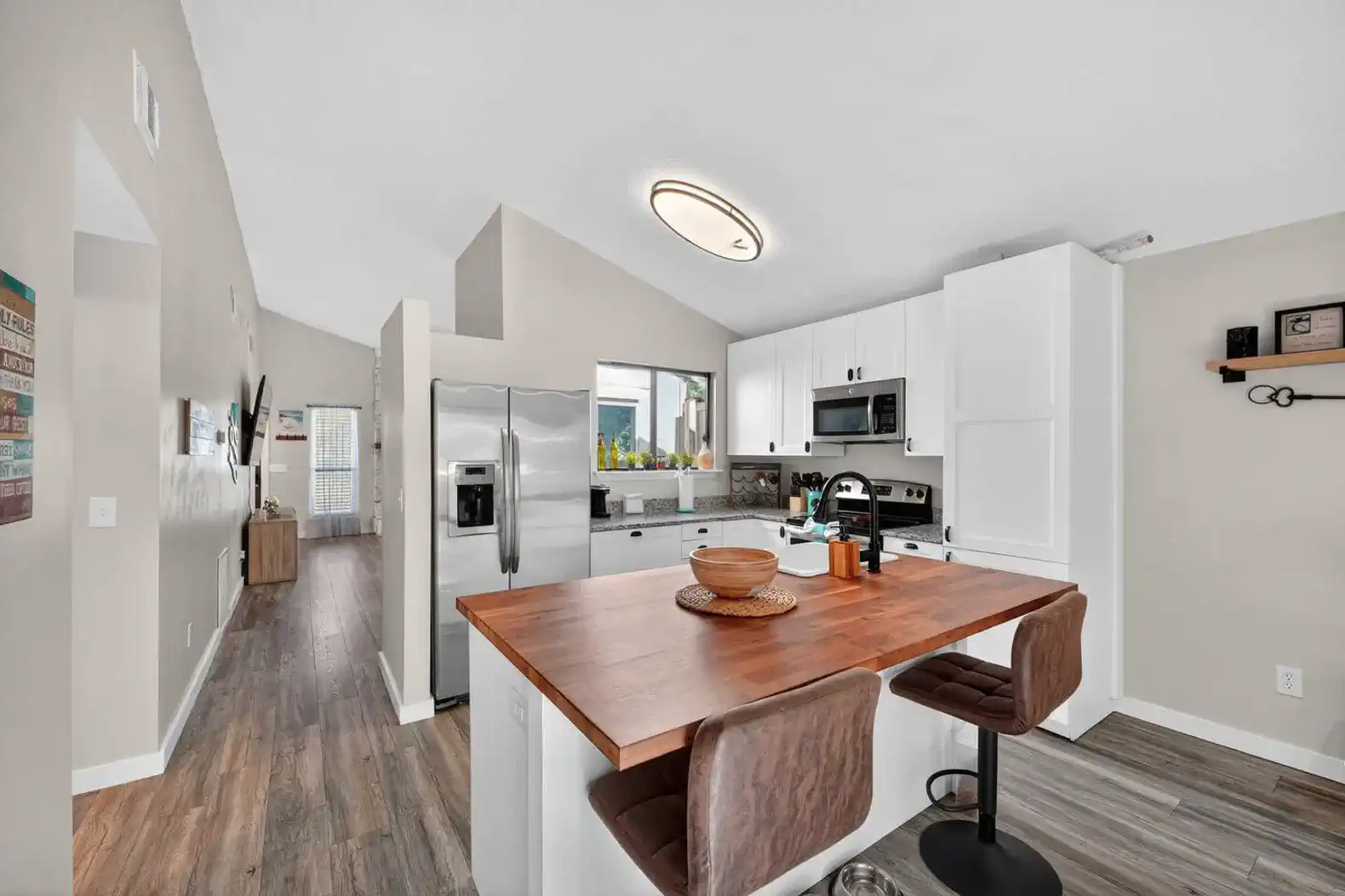 Modern kitchen with island seating and stainless steel appliances