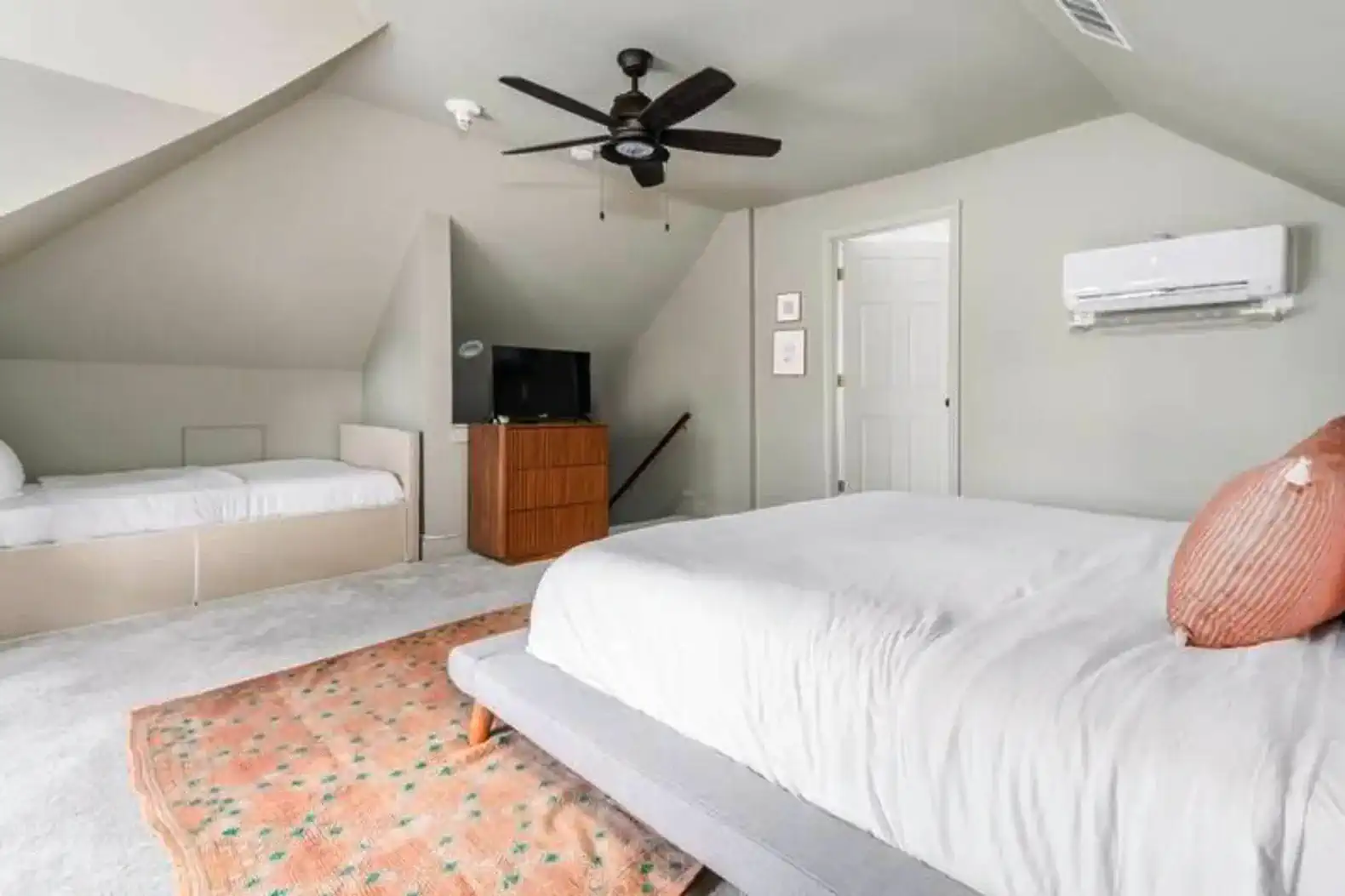 The primary bedroom offers a King Bed, a twin bed, a window bench that is the size of an RV bunk bed and it's own bathroom suite.
