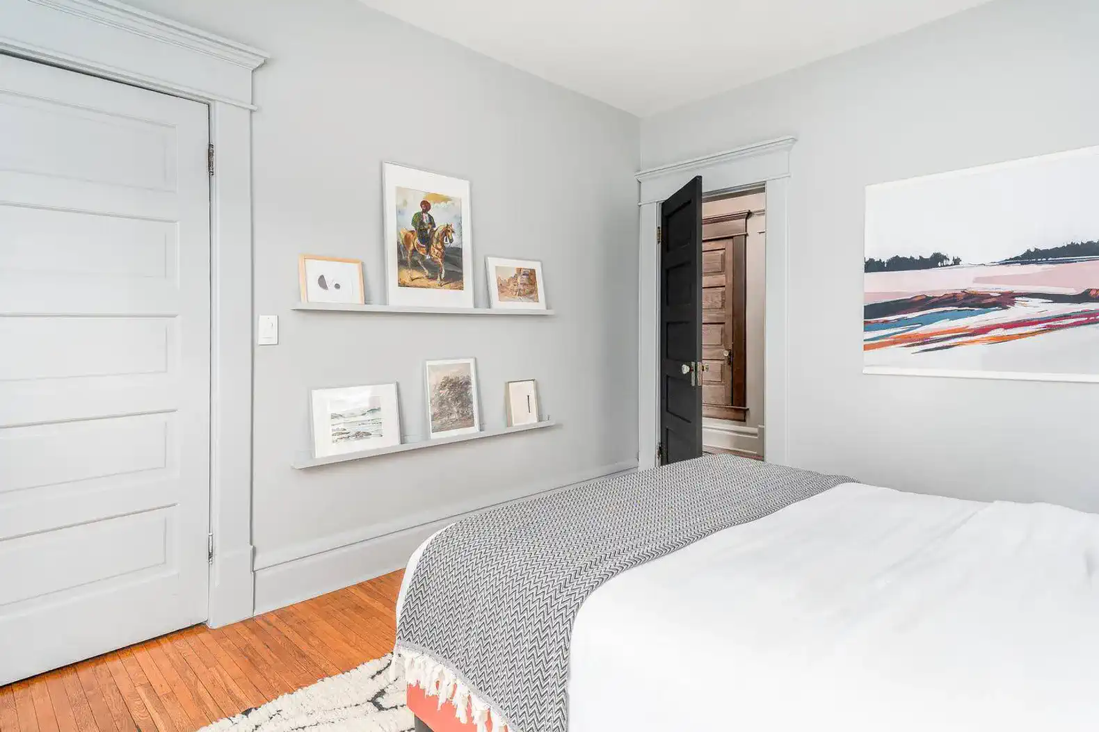 Second Floor | Bedroom 2 | Queen bed, desk workspace, closet with hangers and luggage rack