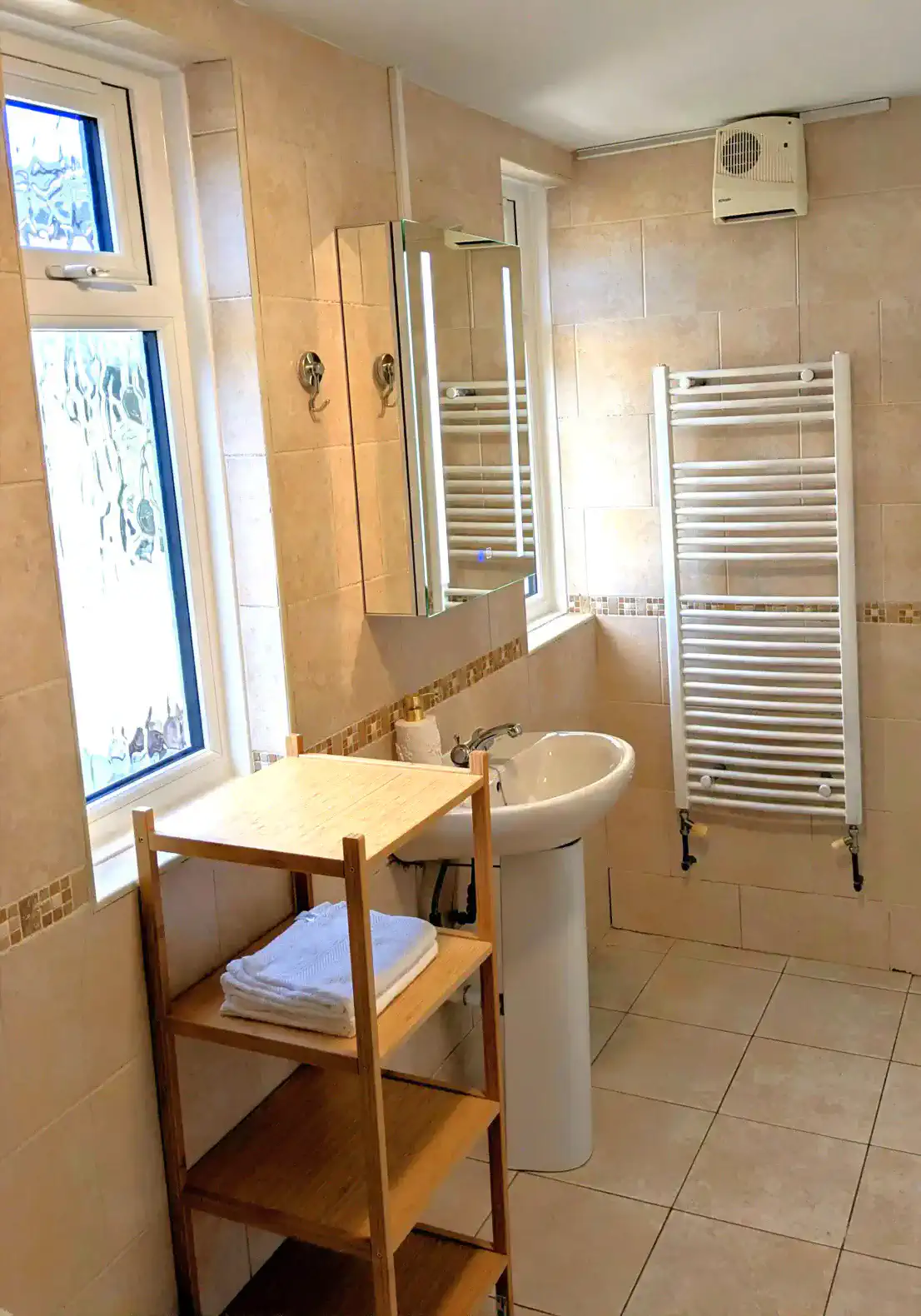 Bright and spacious bathroom with modern fixtures and natural light