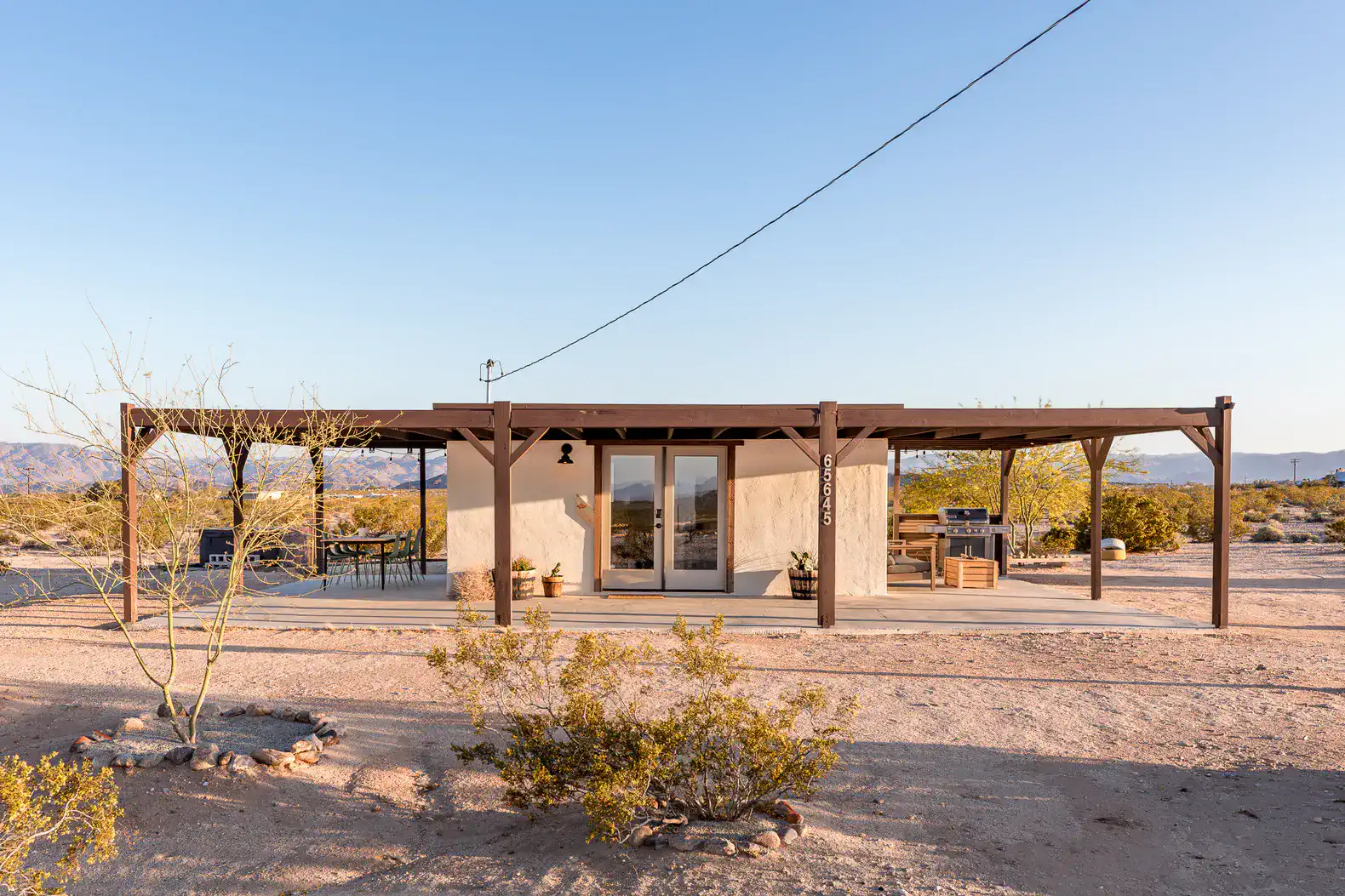 Desert retreat with a covered patio and outdoor seating area
