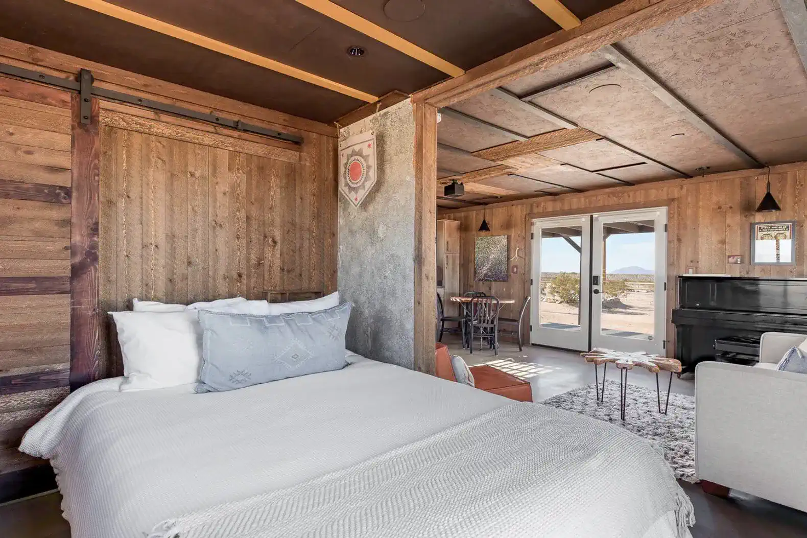 Cozy master bedroom with rustic wood accents and a piano