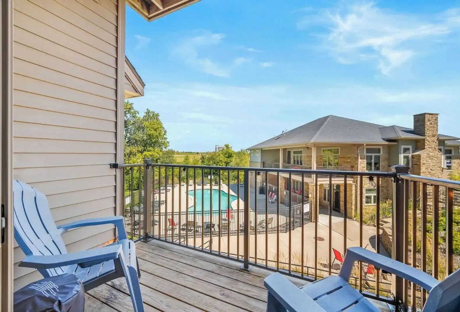 Sip morning coffee or evening wine on your private balcony with seating for two. Enjoy fresh air, treetop views, and a peek at the sparkling pool below—a perfect extension of your stay.