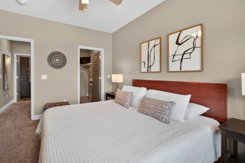 Bright, spacious bedroom with plush king bed and modern decor