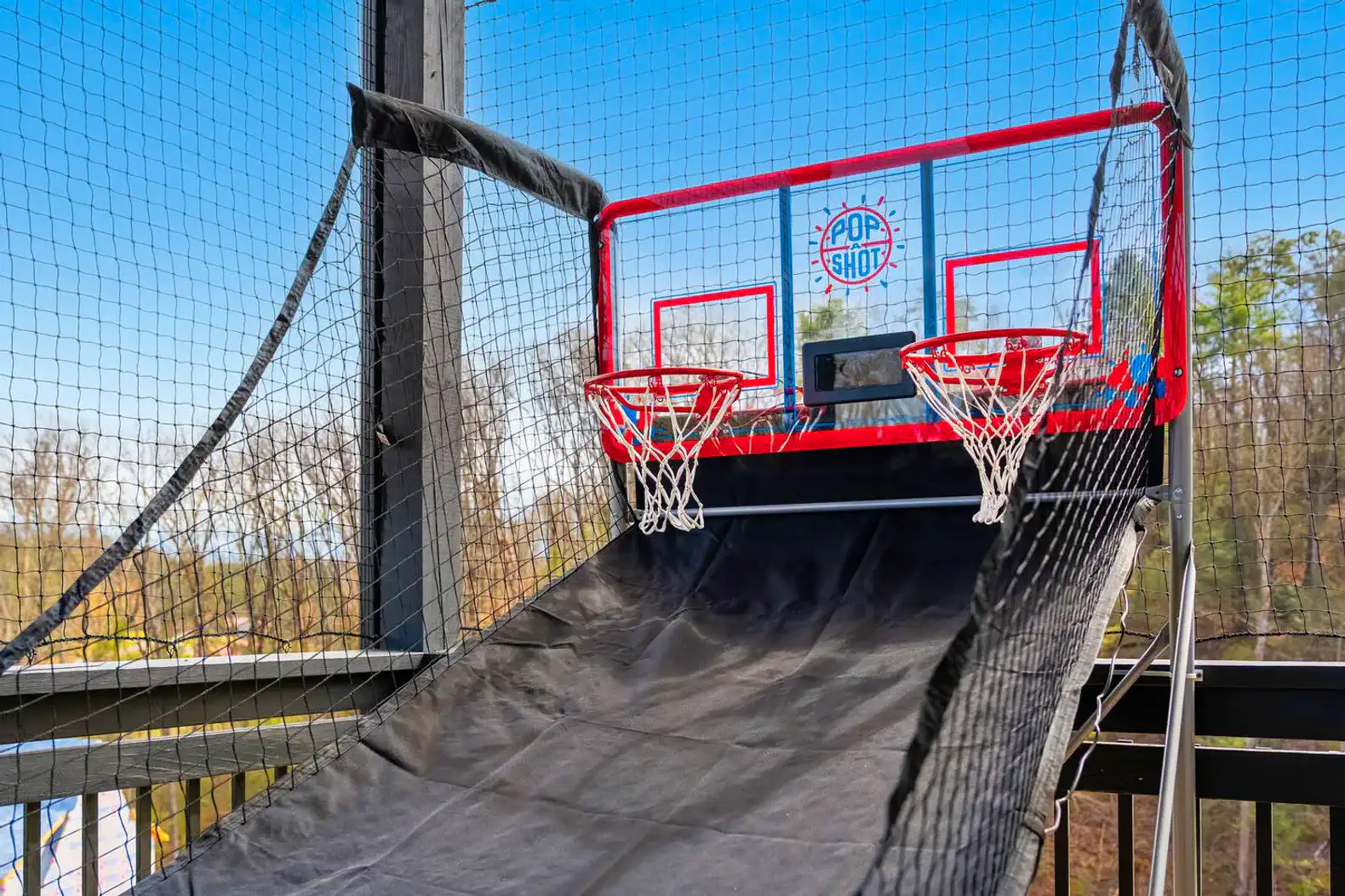 Basketball arcade game with two hoops on a deck