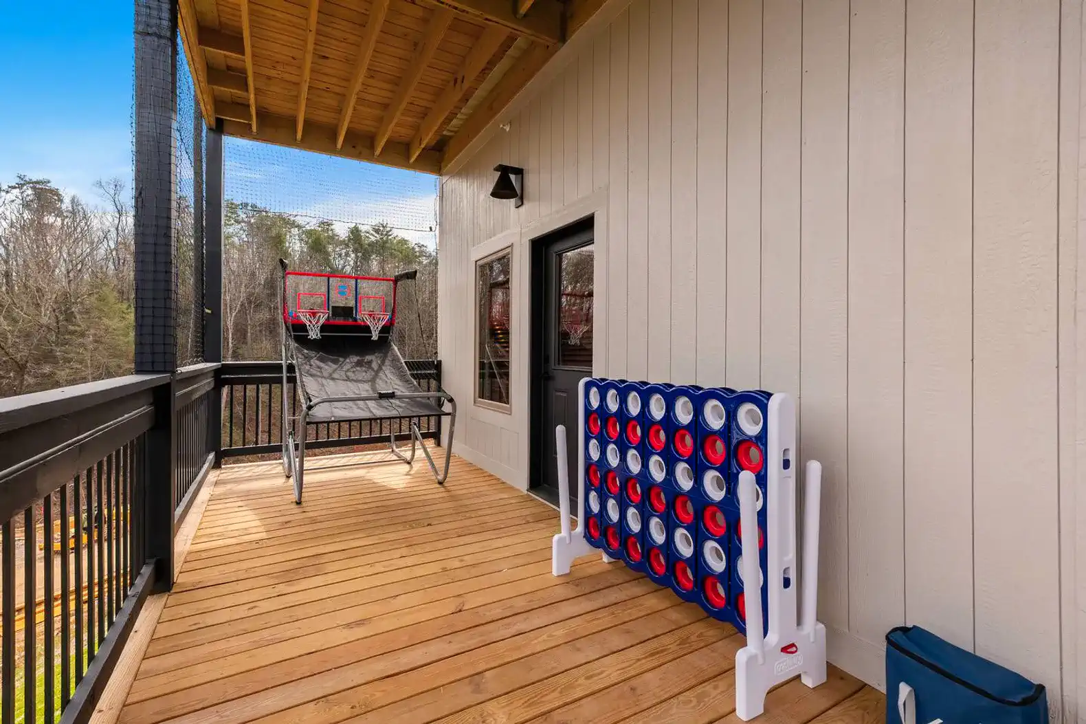 Spacious deck with outdoor games and seating area