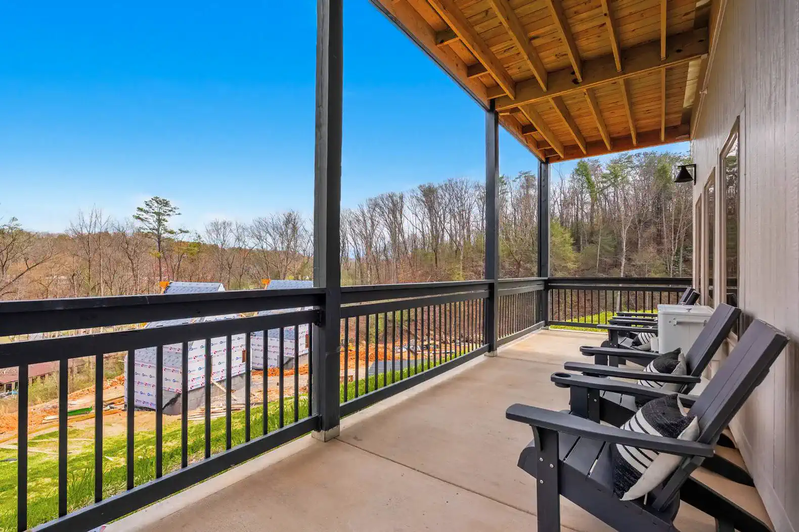 Spacious balcony with seating and scenic views of the surrounding landscape