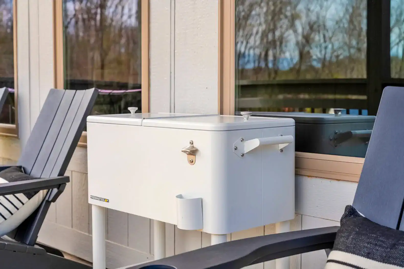 Outdoor cooler next to seating area with a view
