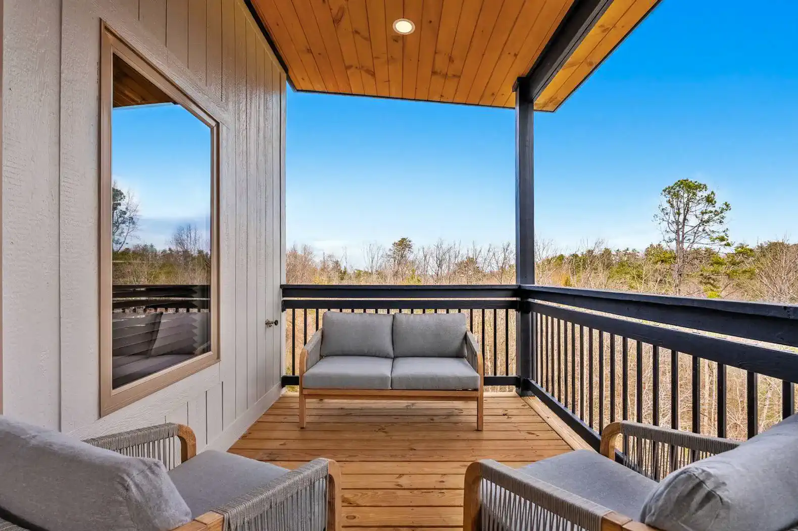 Cozy outdoor seating area on the balcony with scenic views