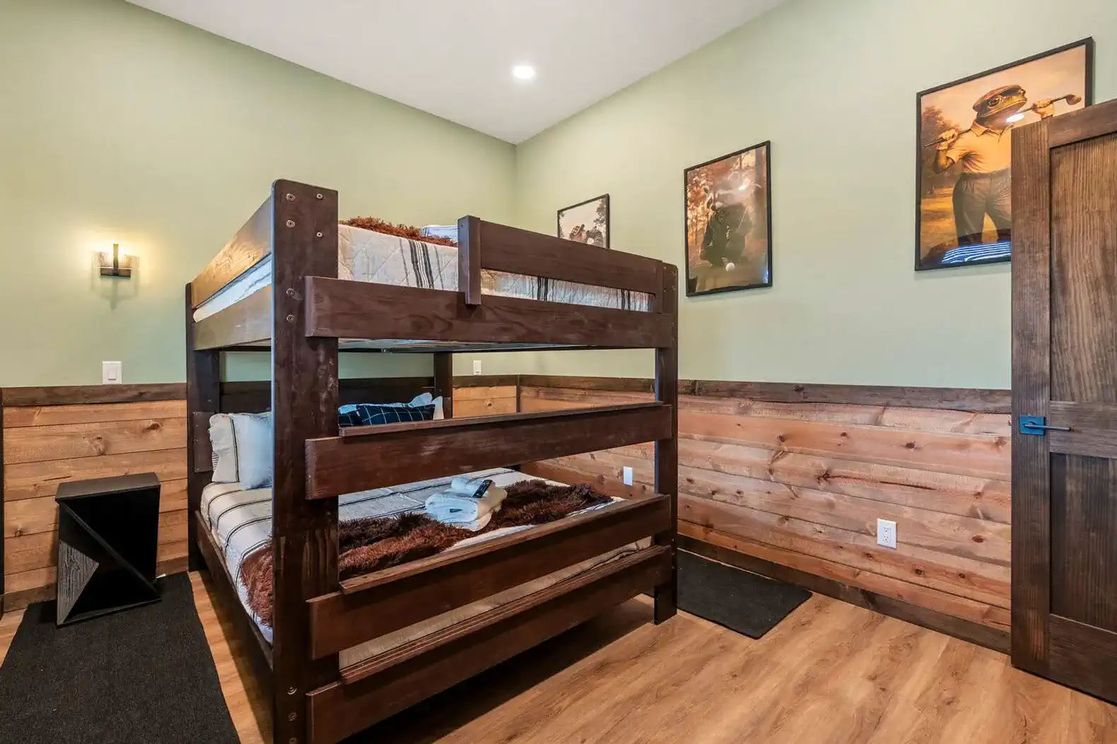 Cozy bunk room with wooden bunk beds and rustic decor