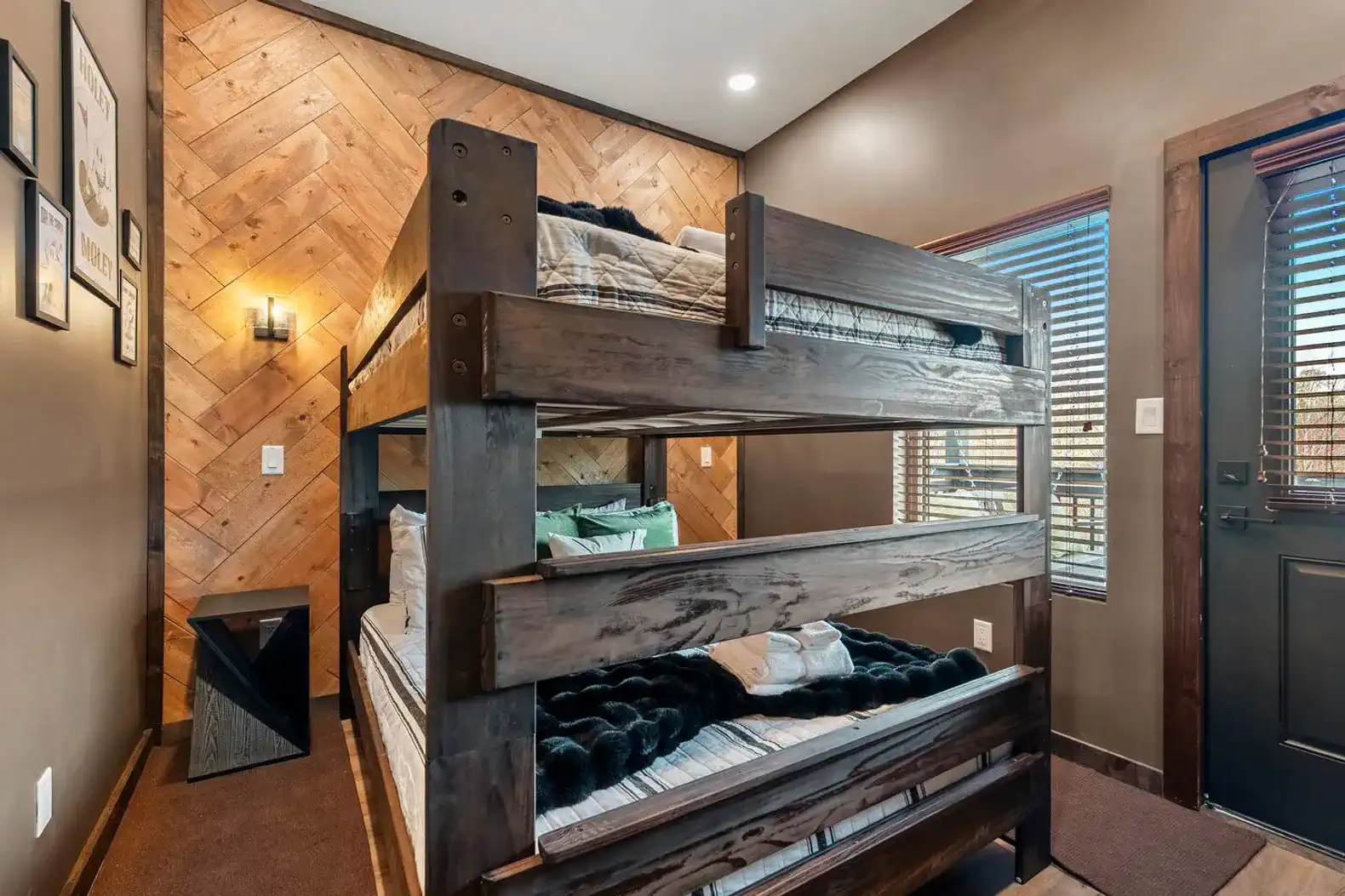 Cozy bunk room with wooden bunk beds and warm lighting