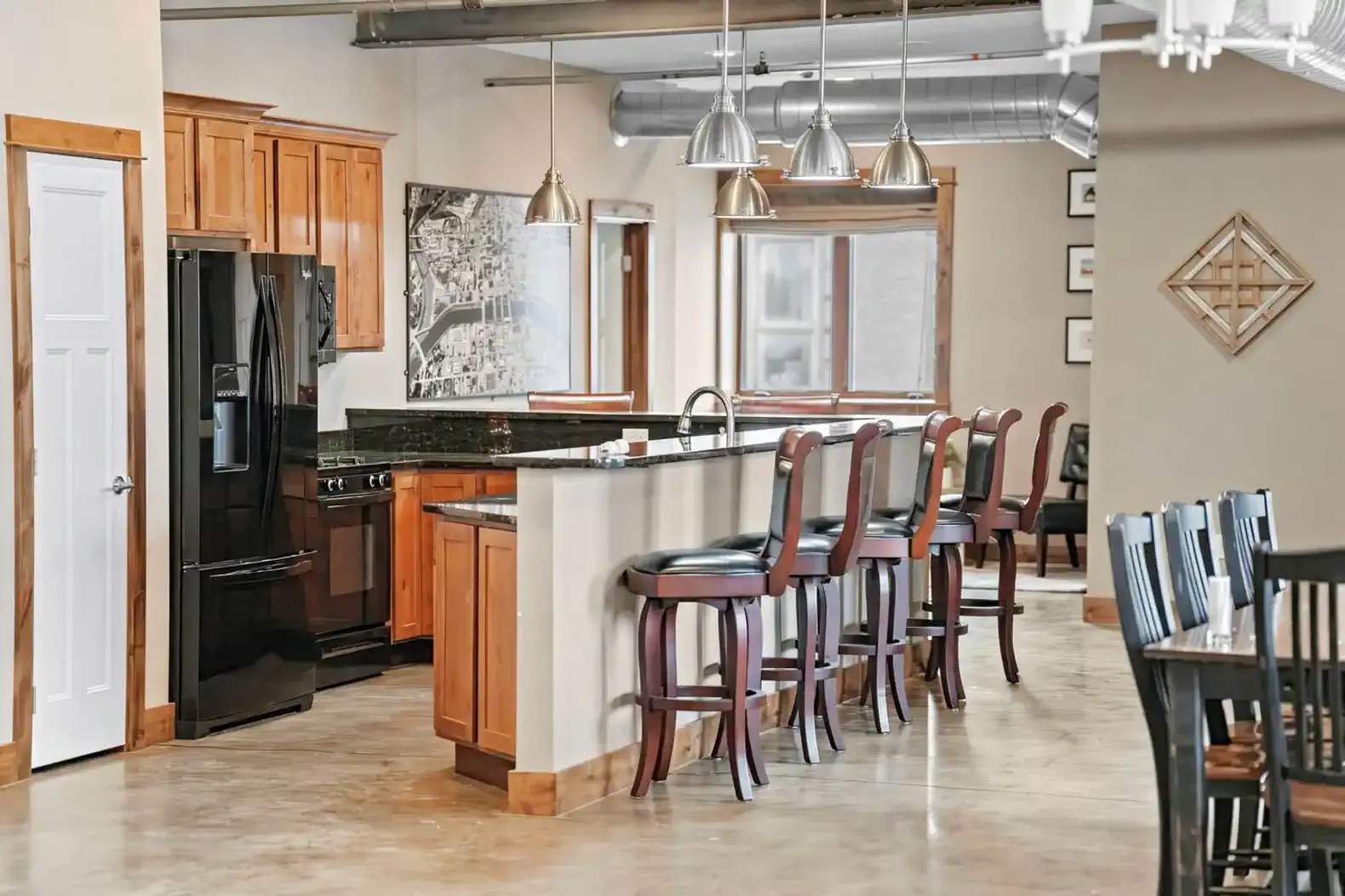 The kitchen with plenty of seating at the bar!