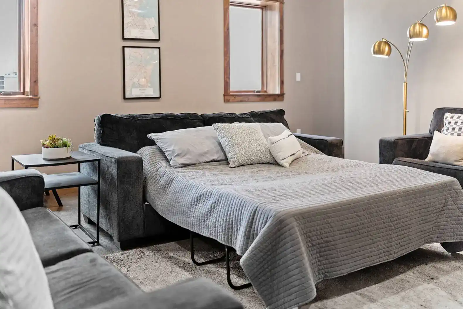 The center sofa in the living room is a sleeper sofa and linens are provided.