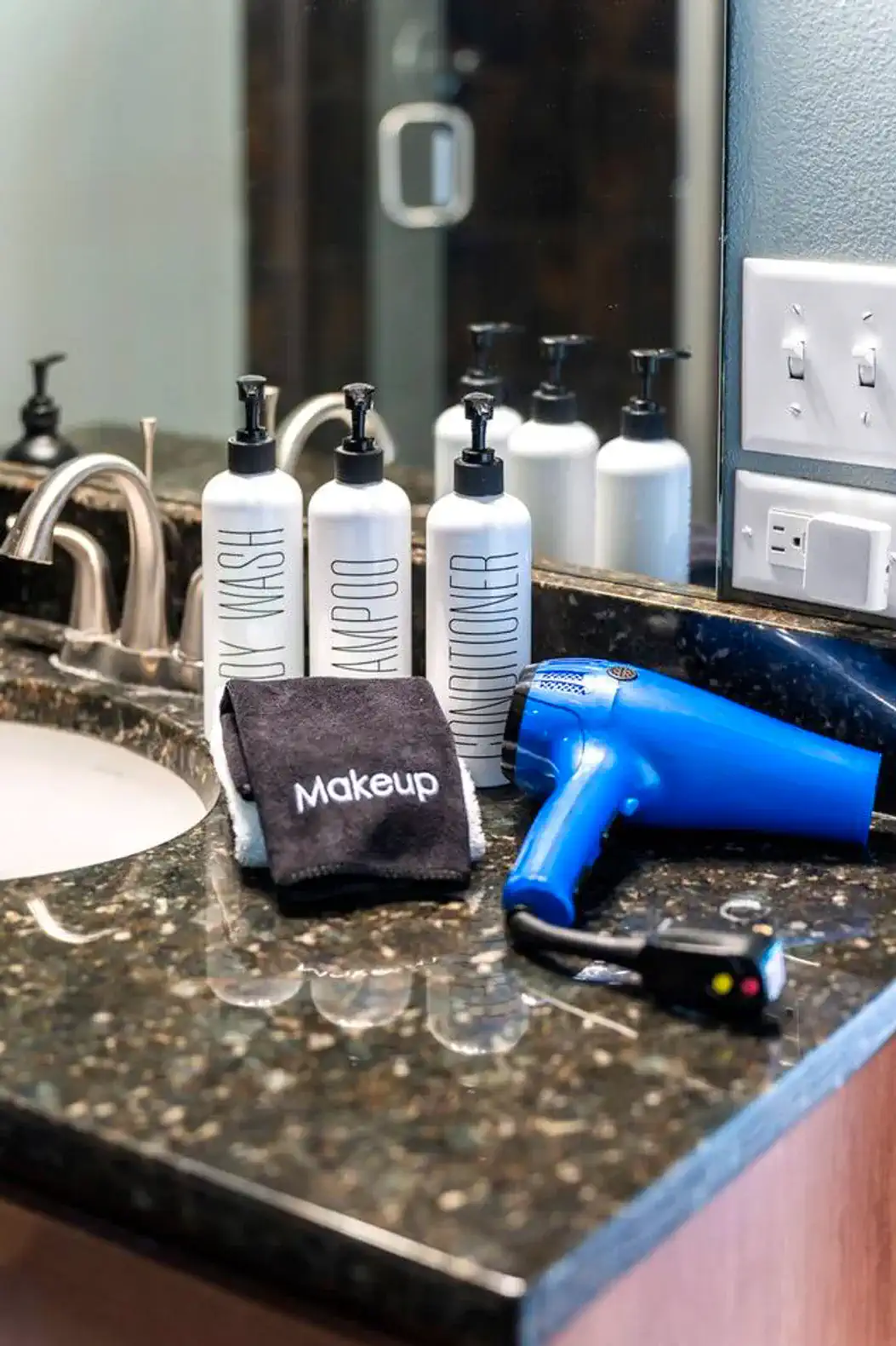 In each bathroom, you'll find shampoo, body wash, conditioner, makeup towels, a hair wrap, hair dryer with attachments and more!