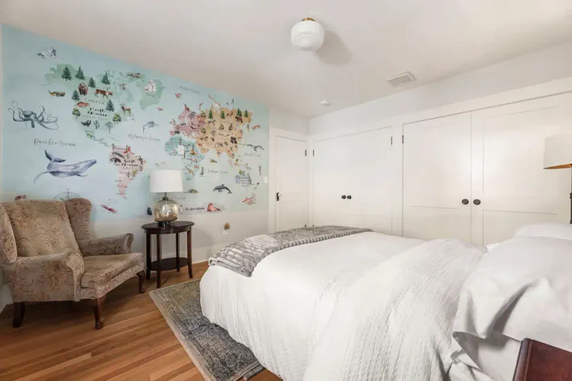 Guest bedroom with full bed, closets, seating
