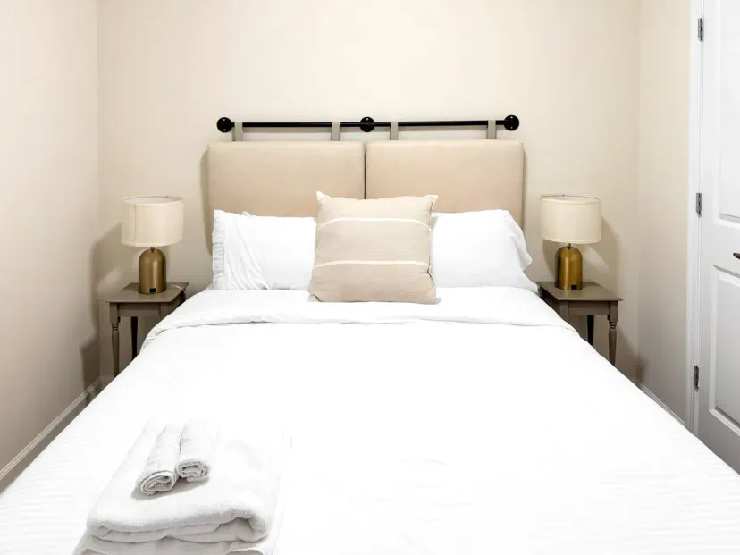 Cozy master bedroom with a comfortable bed and soft lighting