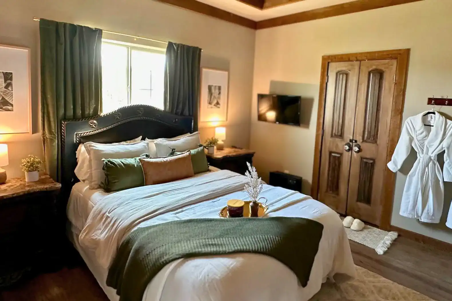 Cozy master bedroom with a plush bed, decorative pillows, and warm lighting