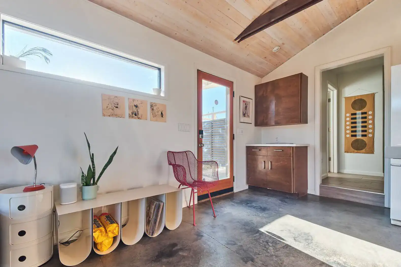 Bright and modern kitchen with wooden ceiling and colorful decor