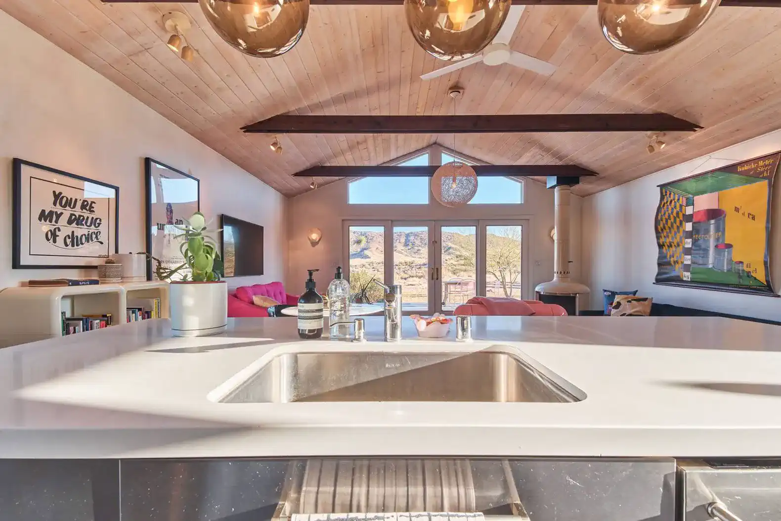 Modern kitchen with a view of the living area and large windows
