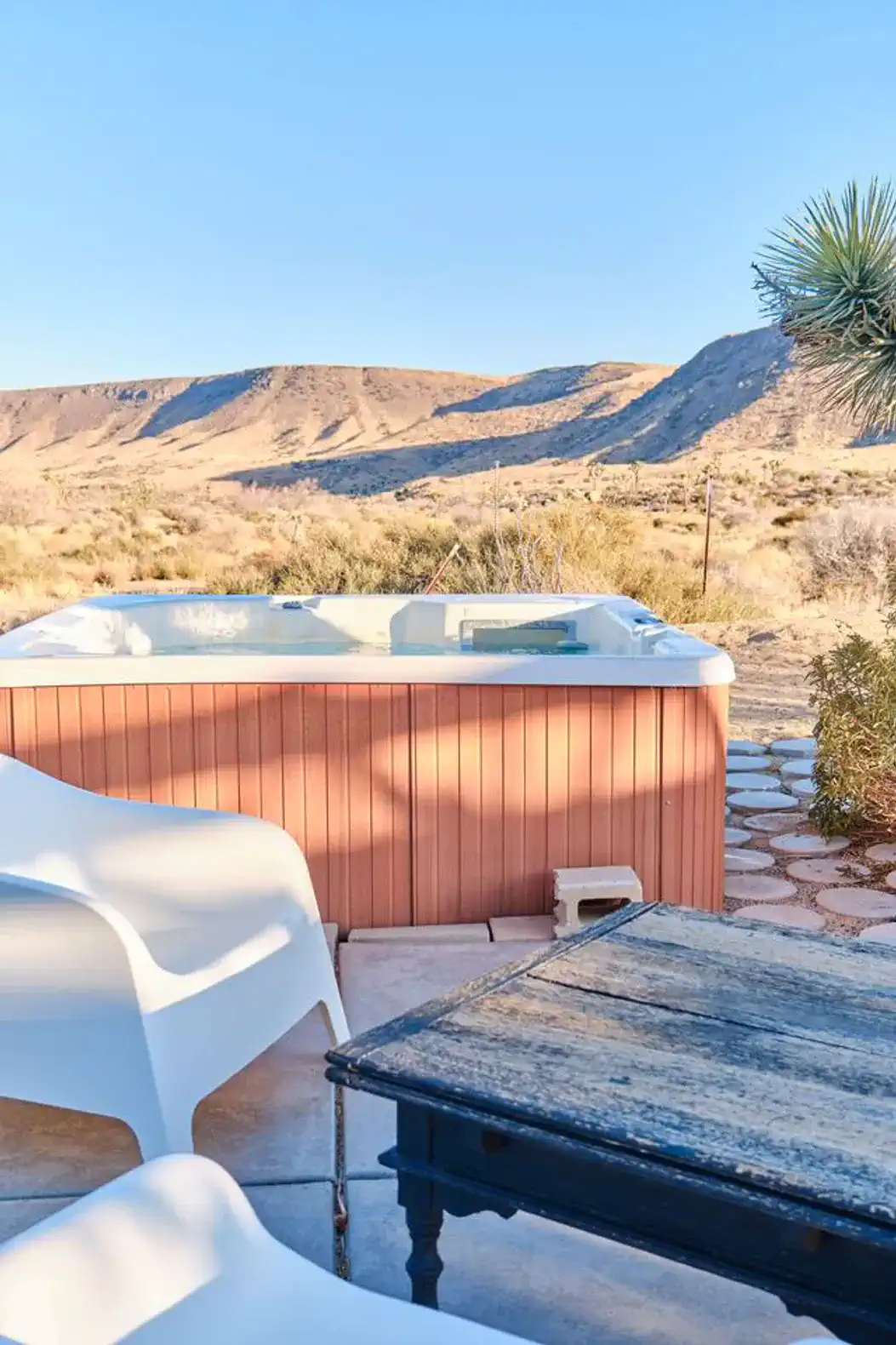 Hot tub with desert view and seating area