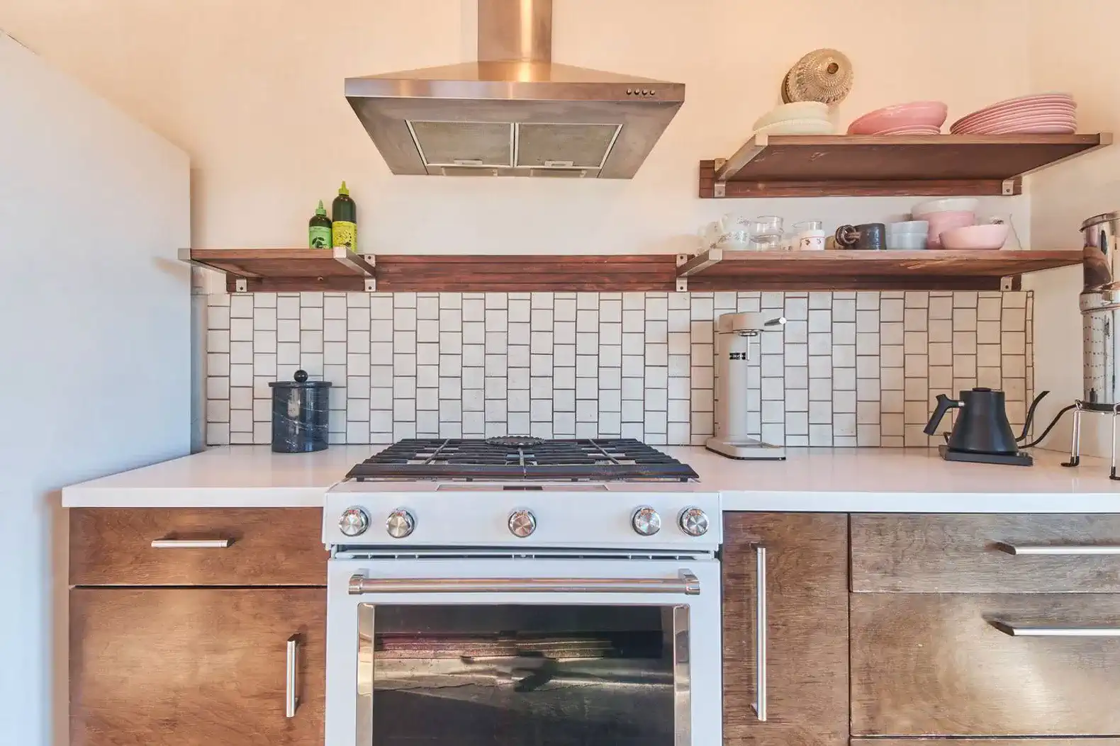 Modern kitchen with stainless steel appliances and open shelving