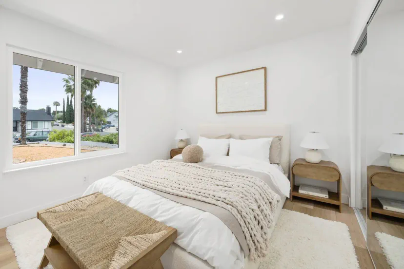 Cozy bedroom with a large window and modern decor