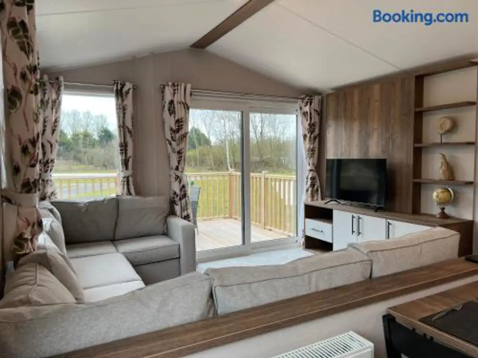 Cozy living room with large windows and a comfortable sofa