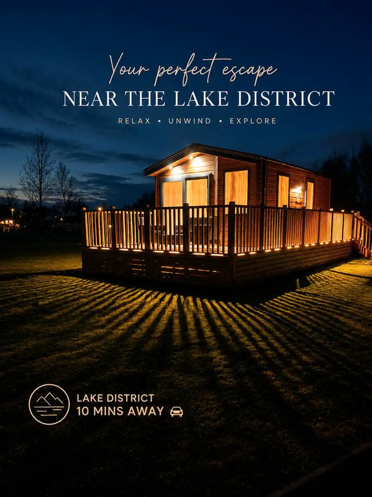 Cozy cabin exterior illuminated at night with wooden deck and surrounding lawn