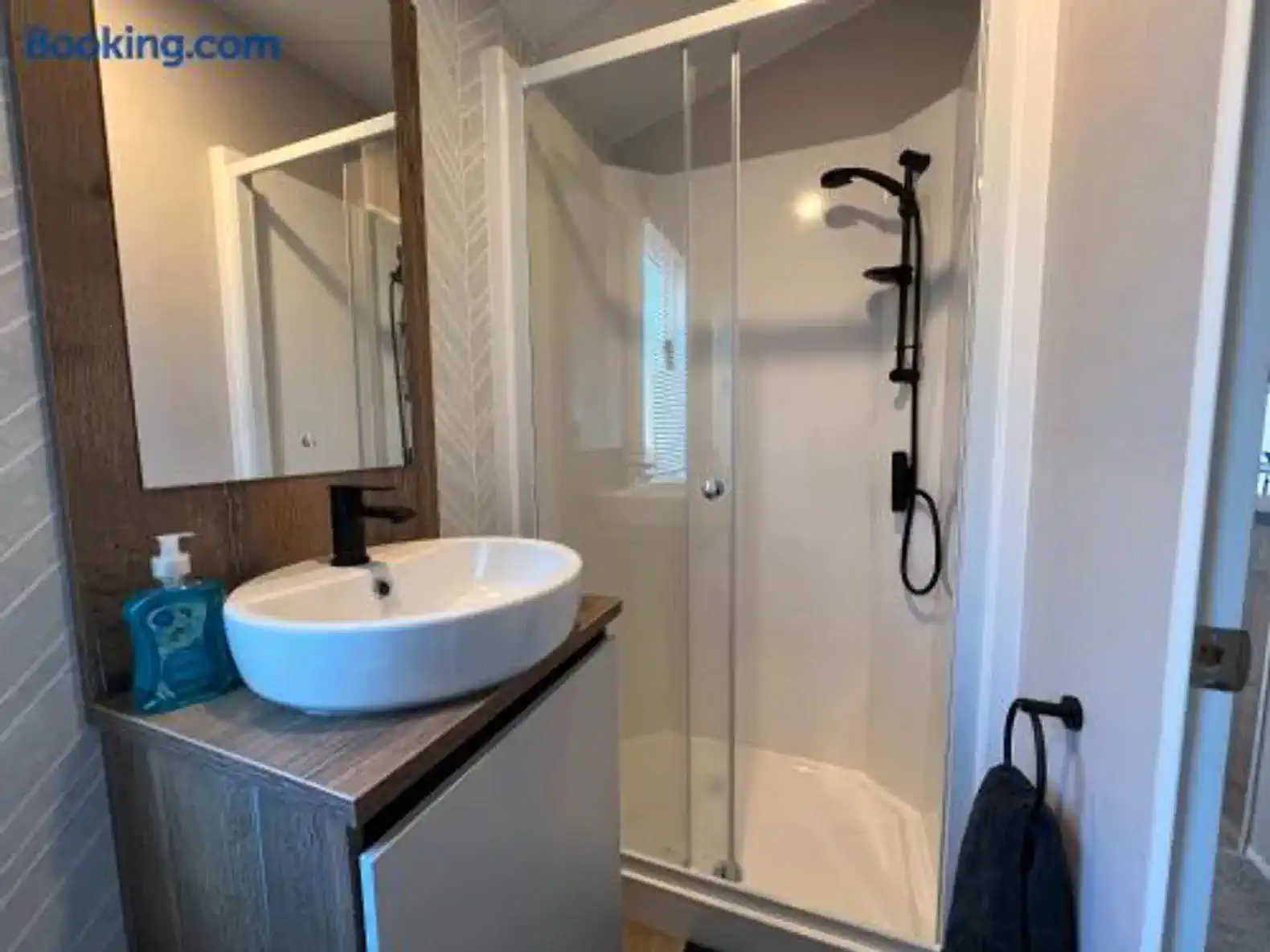 Modern bathroom featuring a walk-in shower and stylish sink