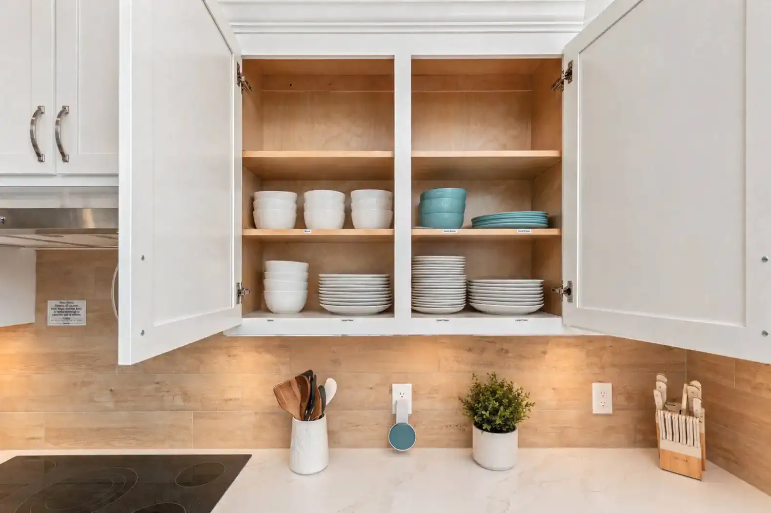 Plenty of dishes, glasses, cooking utensils and supplies at your fingertips.