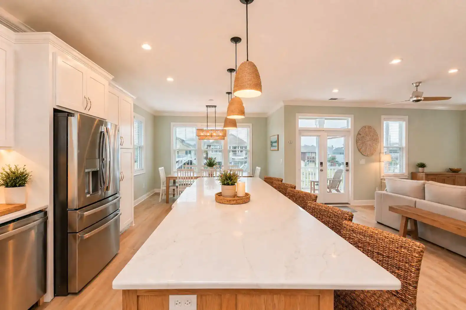 Kitchen island with storage drawers on one side and chairs on the other