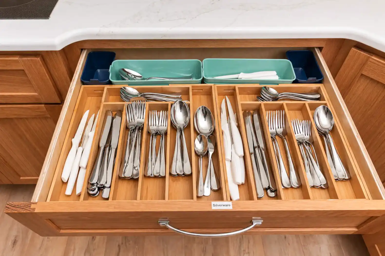 Organized kitchen drawer with utensils and cutlery