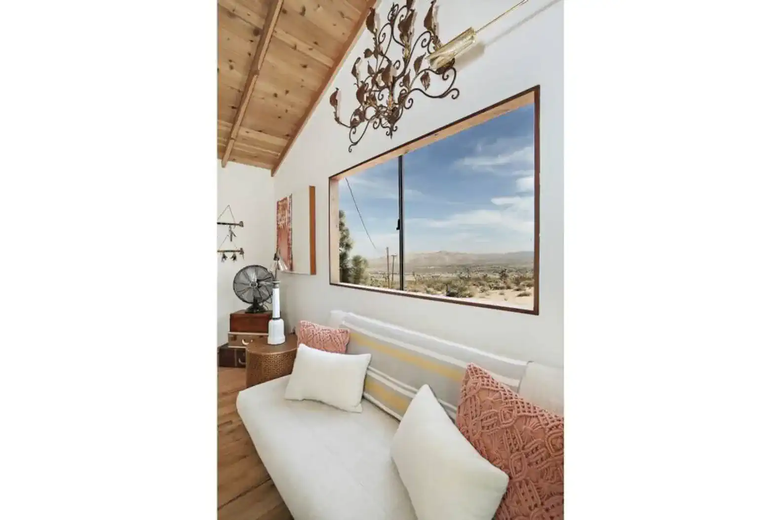 Cozy seating area with large window showcasing desert views