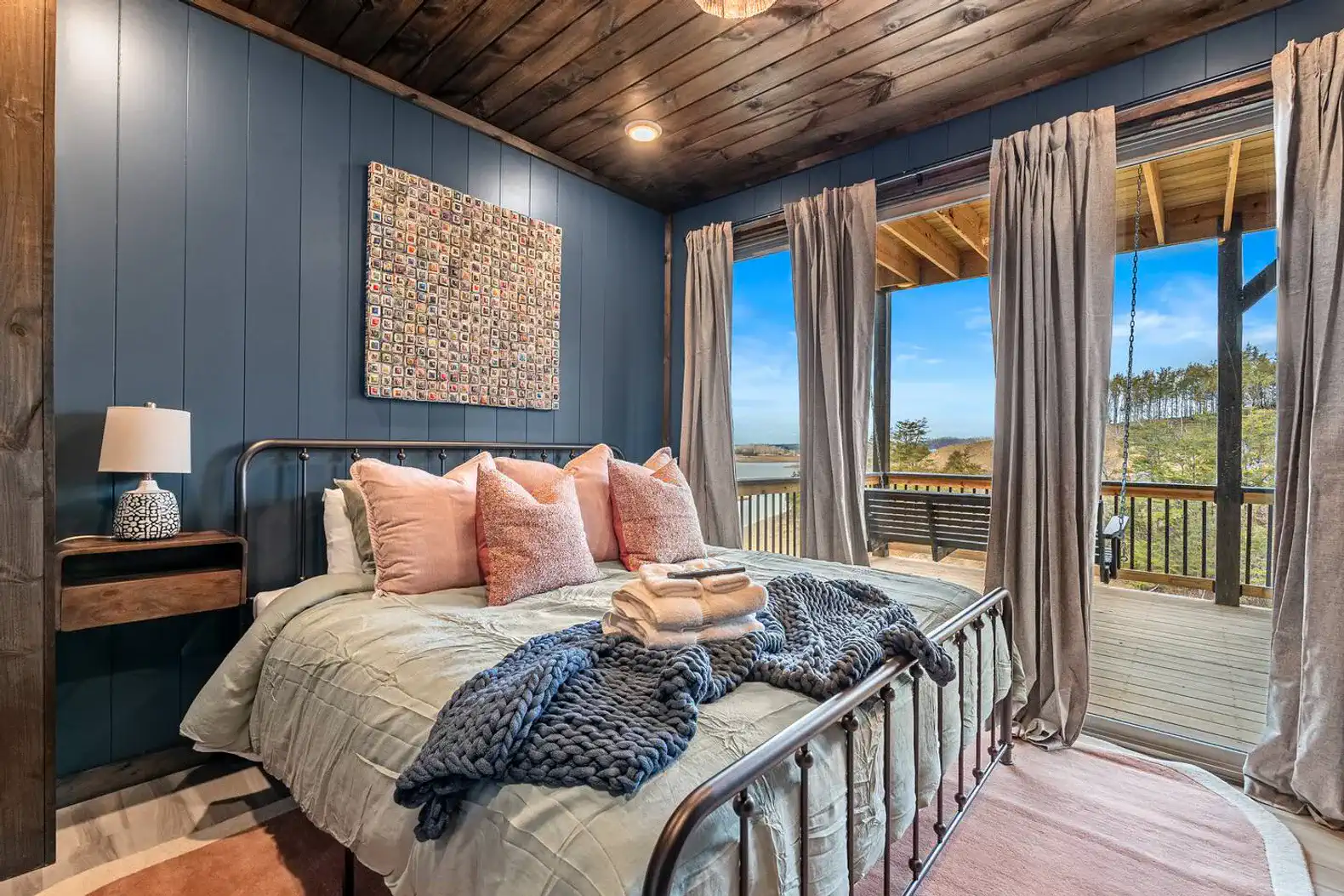 A second king bed located on the second floor with access to the deck and beautiful natural light. 