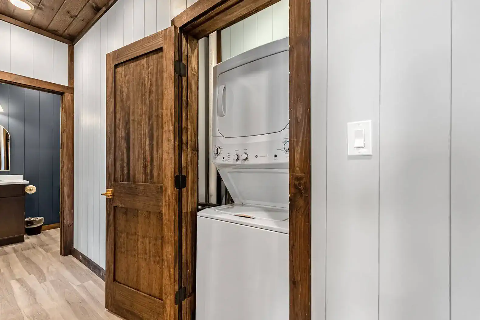 Stacked washer and dryer in the cabin located on the second level. 
