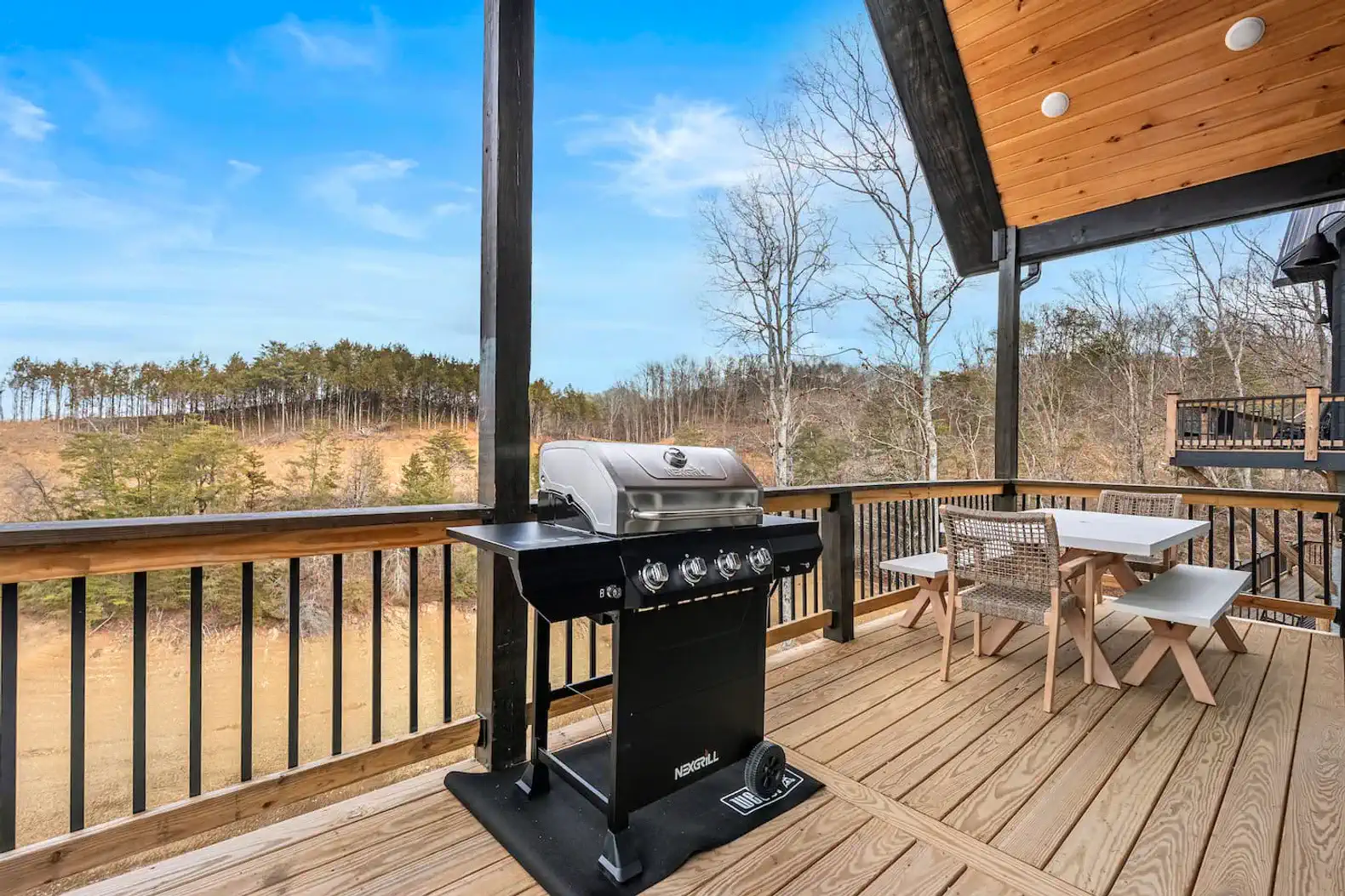 Deck with grill and outdoor dining table so you can enjoy the seasons and views with every meal.