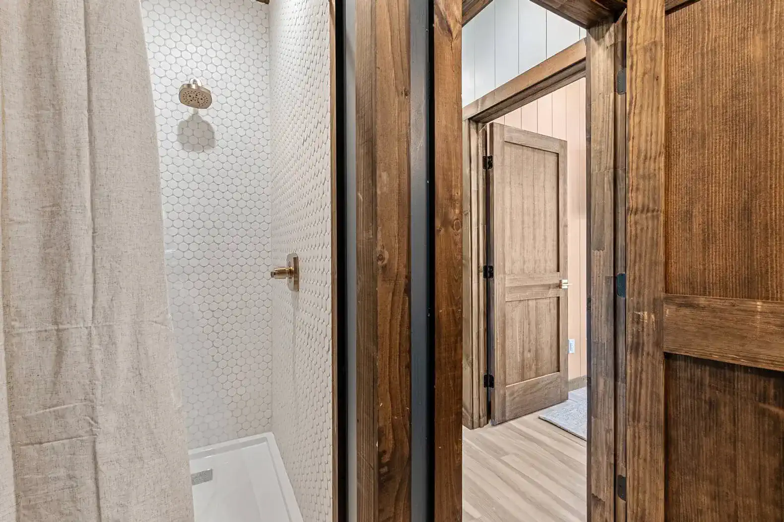 Tiled shower in the third full bathroom located off the third king bedroom.