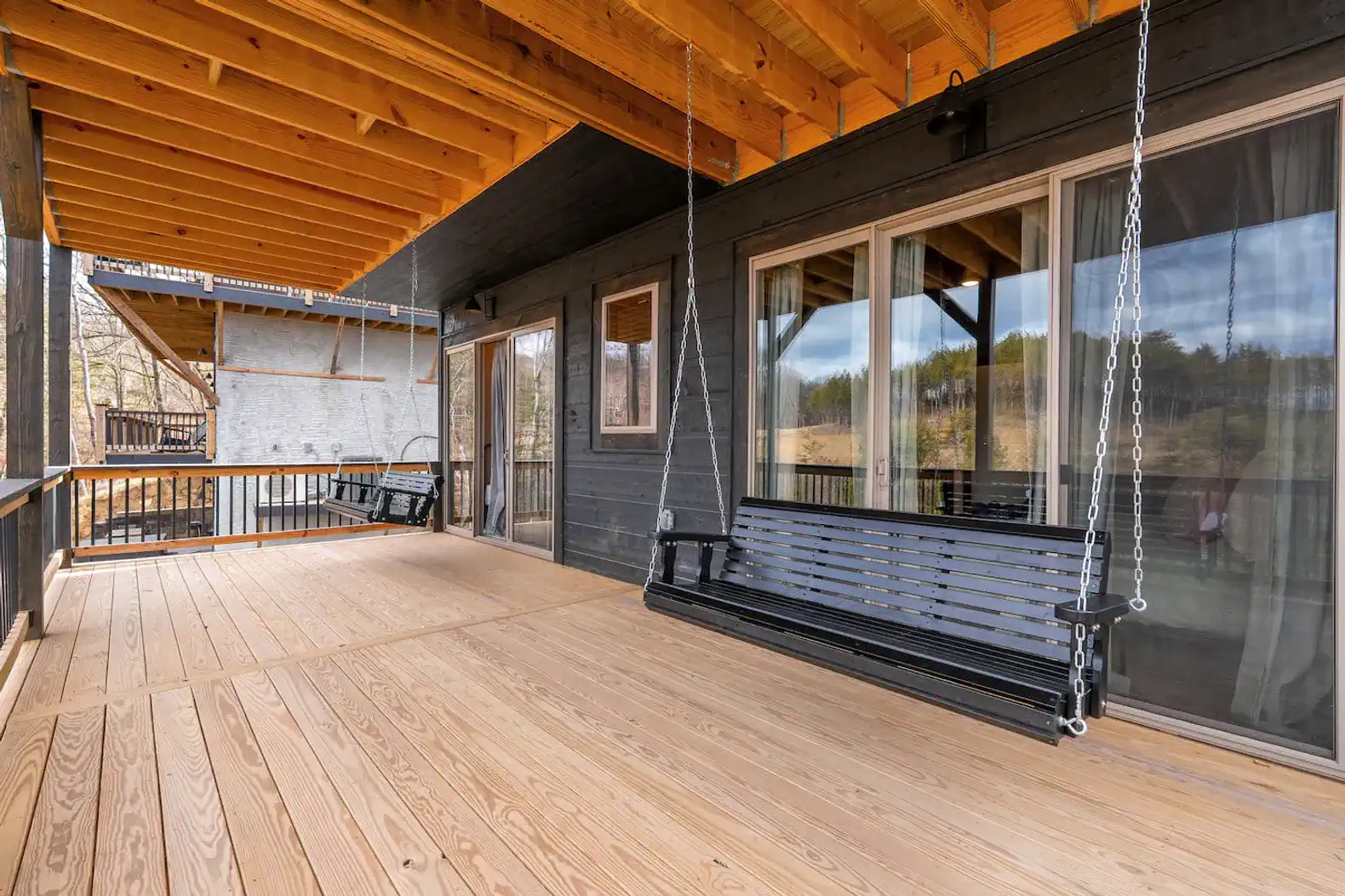 Second level deck with porch swings to soak in the views and weather 