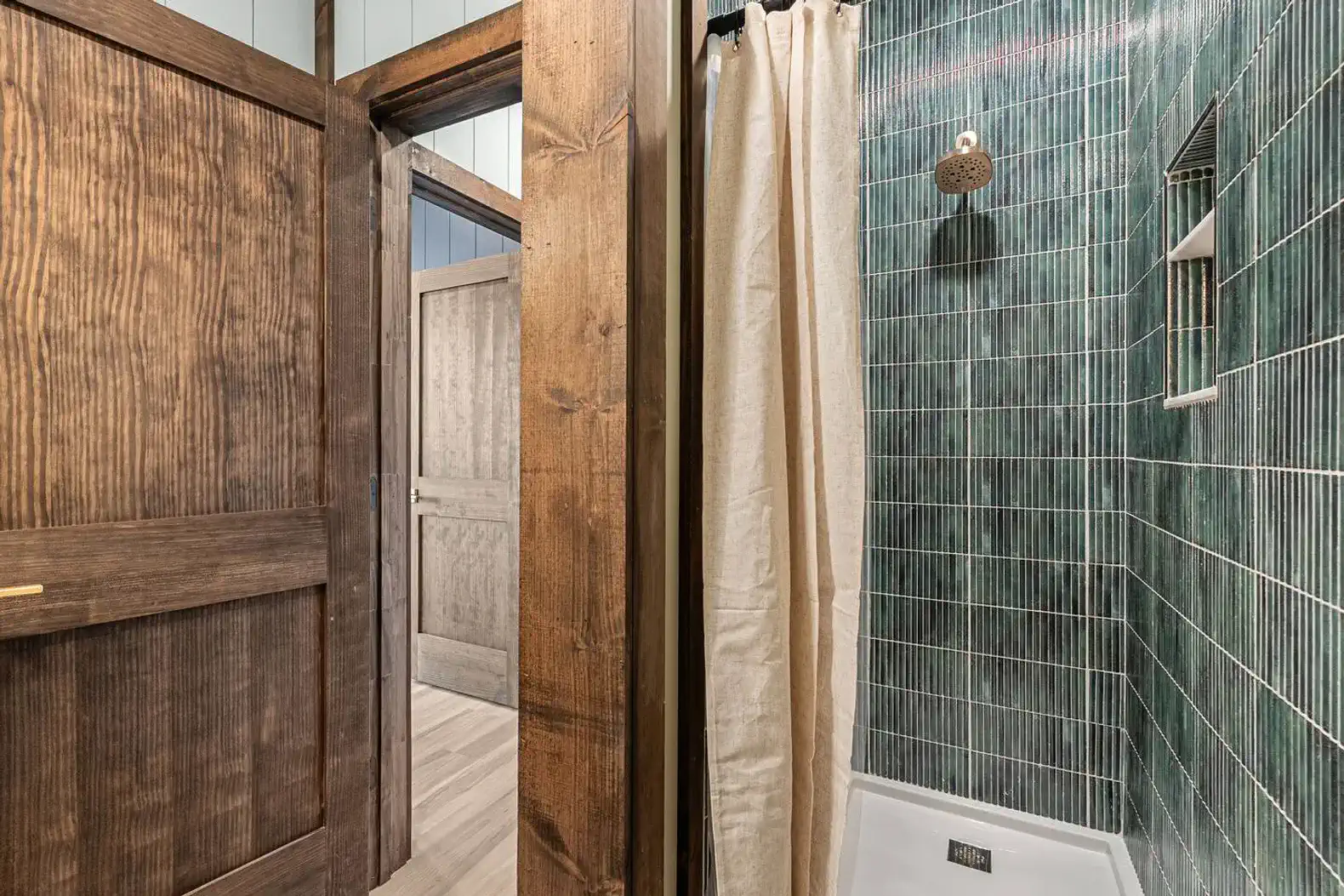 Tiled shower in full bath located right off the second king bedroom.