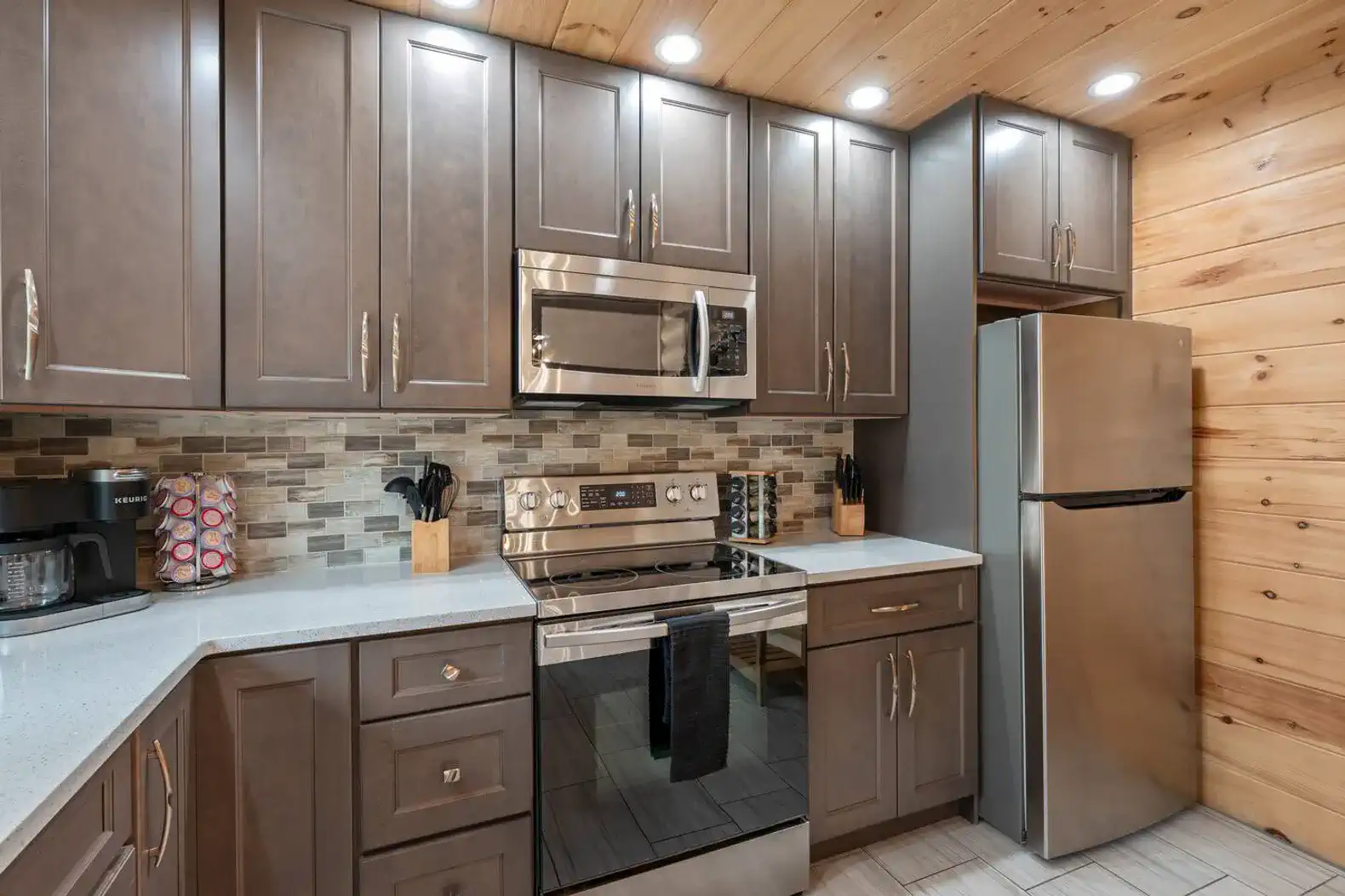 Modern kitchen with stainless steel appliances and wooden accents