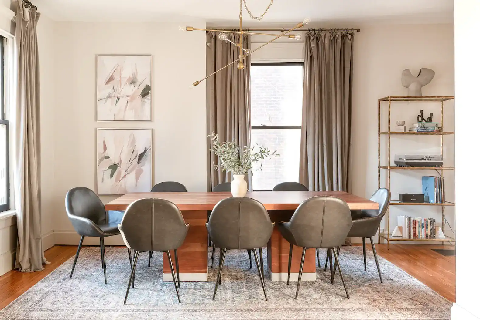 Stylish dining room with a large wooden table and modern chairs