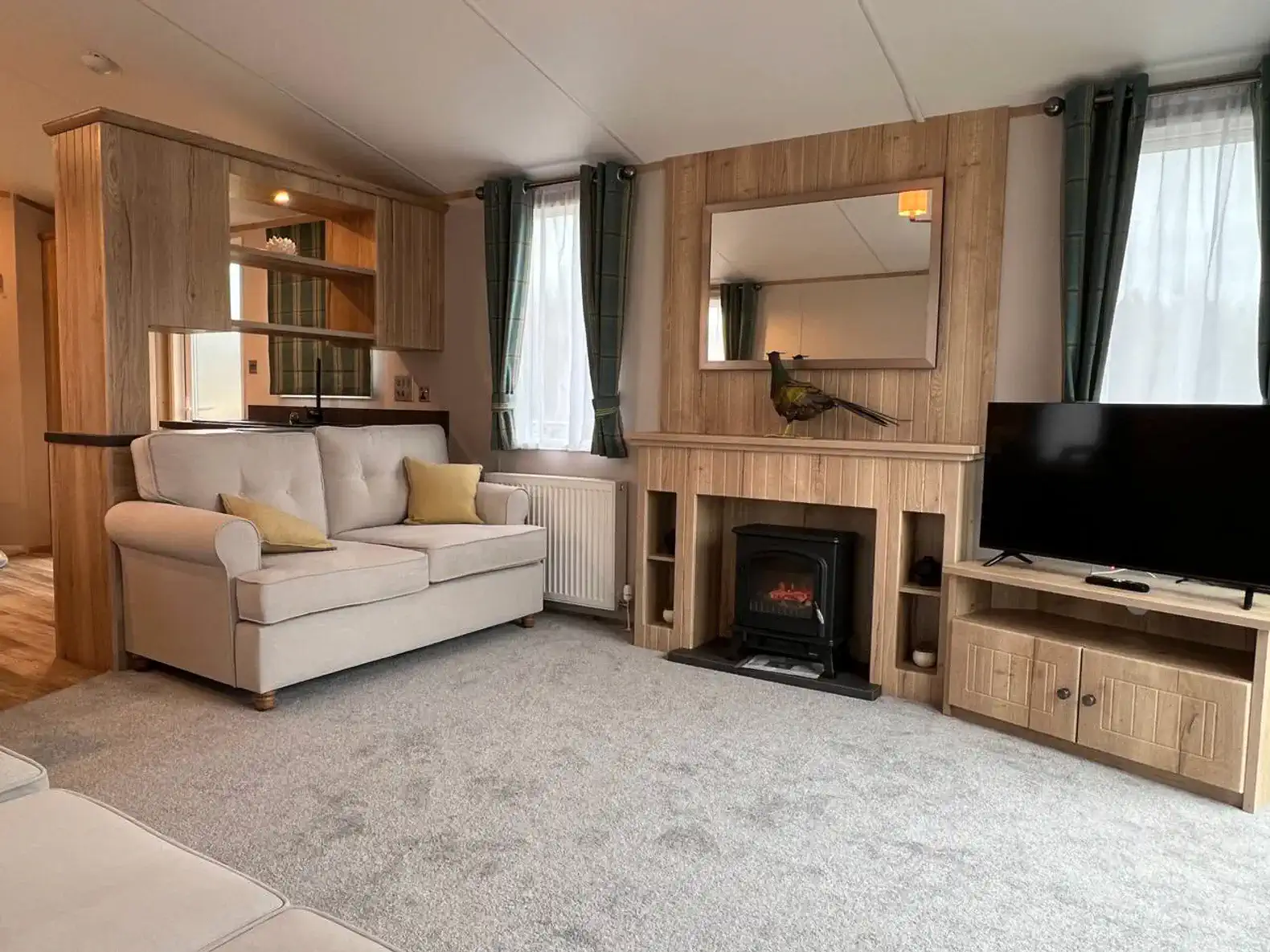 Cozy living room with a fireplace, TV, and comfortable seating