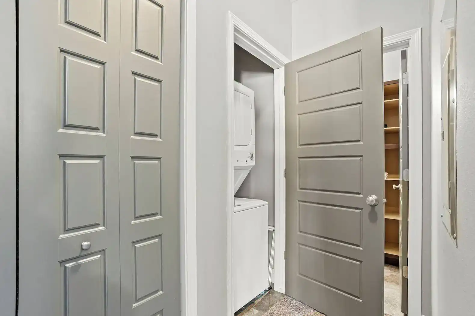 In-unit washer and dryer tucked neatly away for easy, everyday laundry—no shared spaces or trips out required. Nearby storage and pantry space make longer stays simple and keep everything organized and out of sight.