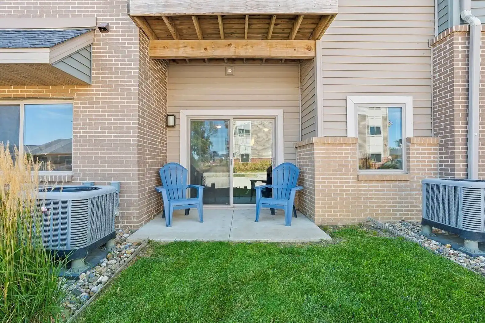 Private first-floor patio with seating (not pictured bistro table, and string lights)—perfect for morning coffee, evening drinks, or enjoying a little outdoor time right outside the living room.