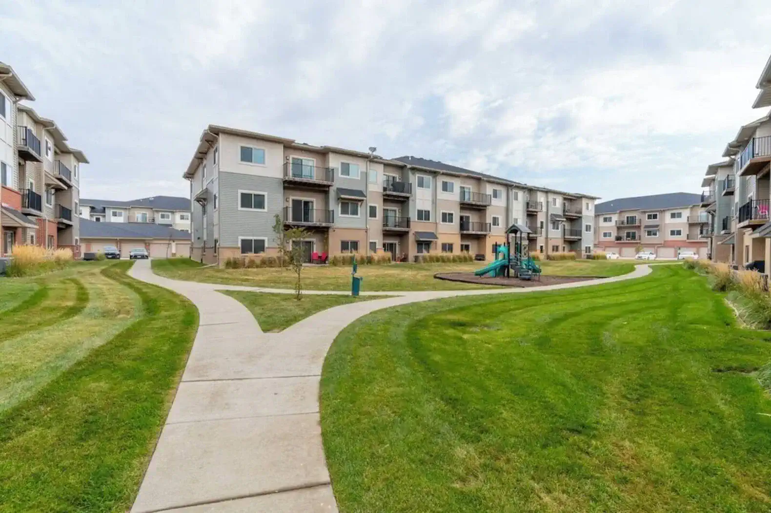 Plenty of green space throughout the entire property that also includes an onsite play area.