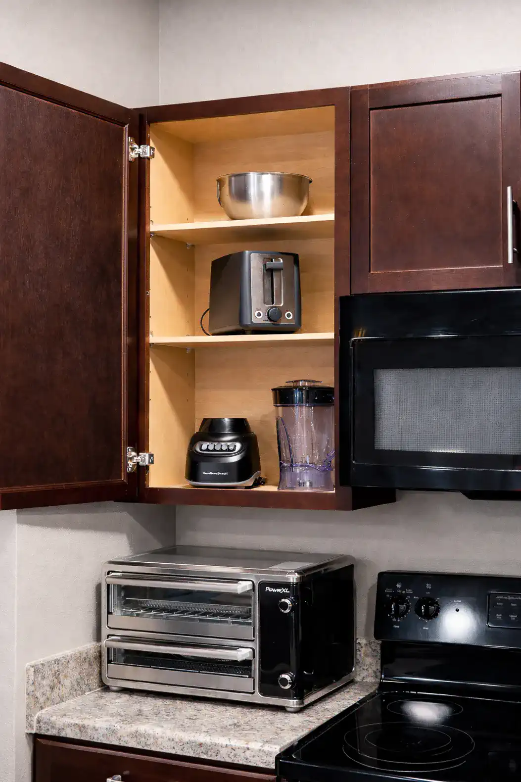 Well stocked with added items including blender, toaster oven and more.