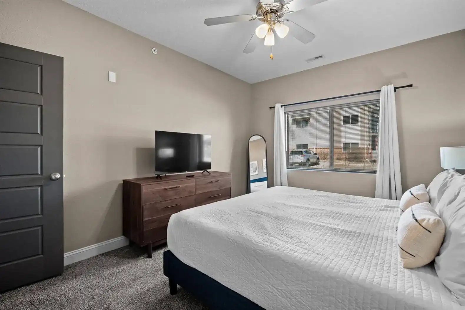 The bedroom offers a generous layout, natural light, and clean, uncluttered setup—simple, comfortable, and easy to settle into.