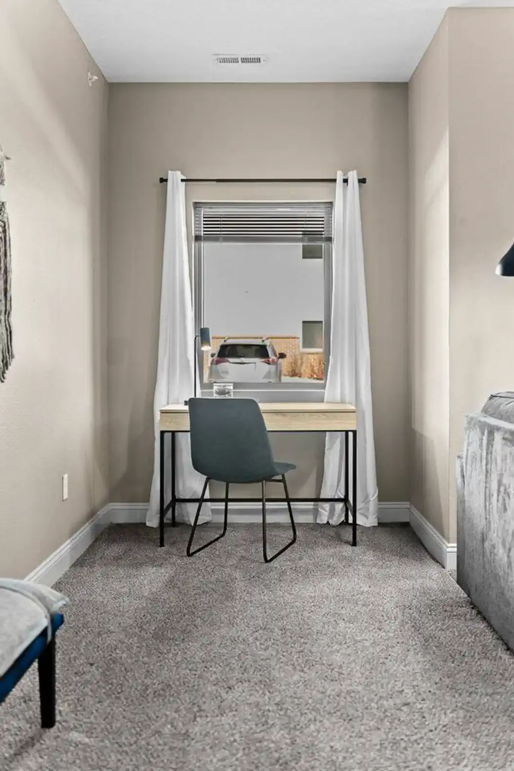 Quiet, dedicated workspace tucked near a window—perfect for focused work, video calls, or planning your day with natural light and minimal distractions.